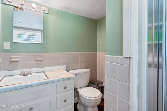 898 W Cunningham St, Alcoa, TN 37701 - half bath with tile walls, vanity, and wainscoting