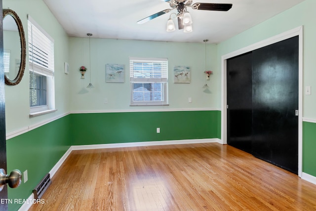 898 W Cunningham St, Alcoa, TN 37701 - spare room with wood finished floors and ceiling fan