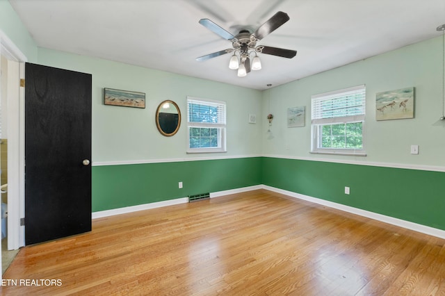 898 W Cunningham St, Alcoa, TN 37701 - spare room featuring healthy amount of natural light, wood finished floors, and a ceiling fan