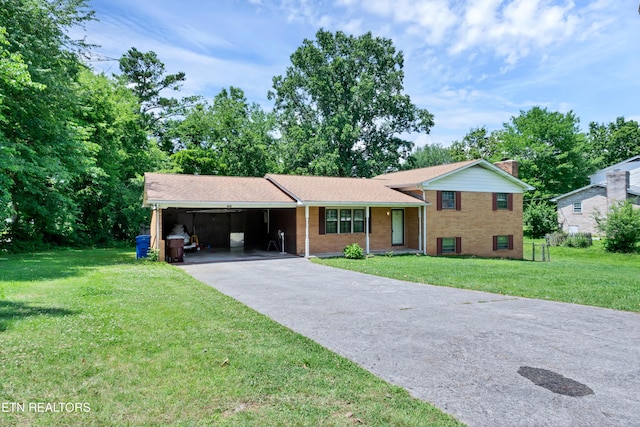 898 W Cunningham St, Alcoa, TN 37701 - tri-level home with an attached carport, driveway, a front lawn, brick siding, and a chimney