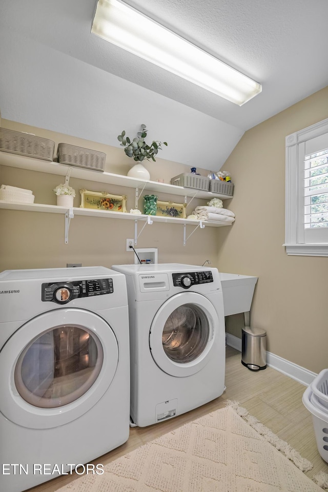 920 Andover View Ln, Knoxville, TN 37922 - washroom featuring washer and clothes dryer and wood finished floors