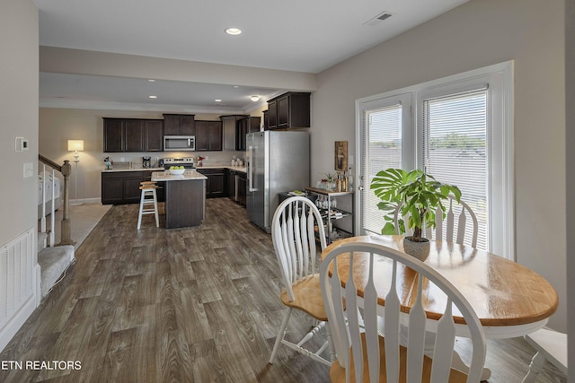 3038 Lazy River Dr, Knoxville, TN 37931 - dining space with dark wood-type flooring, stairs, and recessed lighting