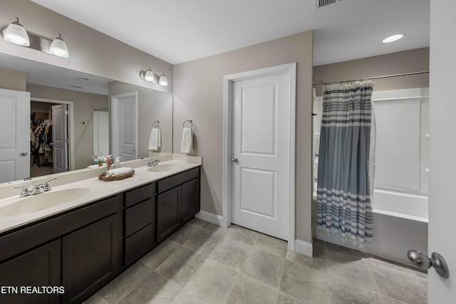 3038 Lazy River Dr, Knoxville, TN 37931 - bathroom featuring double vanity, a walk in closet, and shower / bath combination with curtain