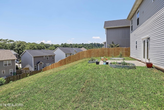 3038 Lazy River Dr, Knoxville, TN 37931 - view of yard featuring a vegetable garden and a residential view