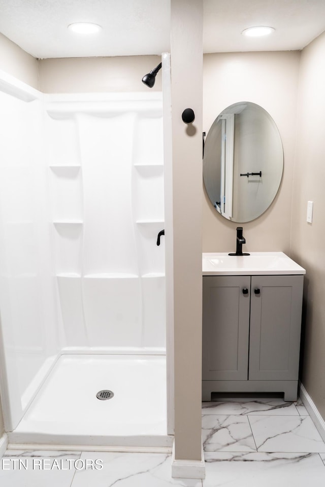 711 E Mountcastle St, Jefferson City, TN 37760 - bathroom featuring vanity, marble look tiles, a shower, and recessed lighting