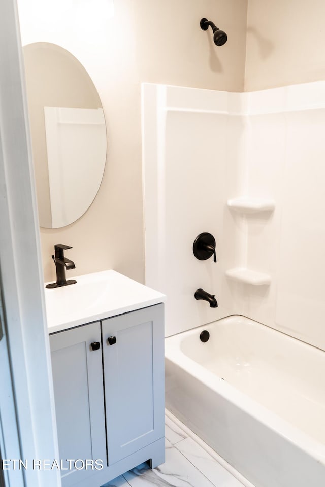 711 E Mountcastle St, Jefferson City, TN 37760 - full bathroom featuring vanity, marble finish floors, and washtub / shower combination
