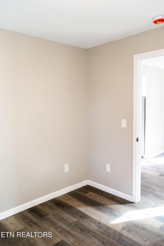 711 E Mountcastle St, Jefferson City, TN 37760 - spare room with dark wood-style floors and baseboards
