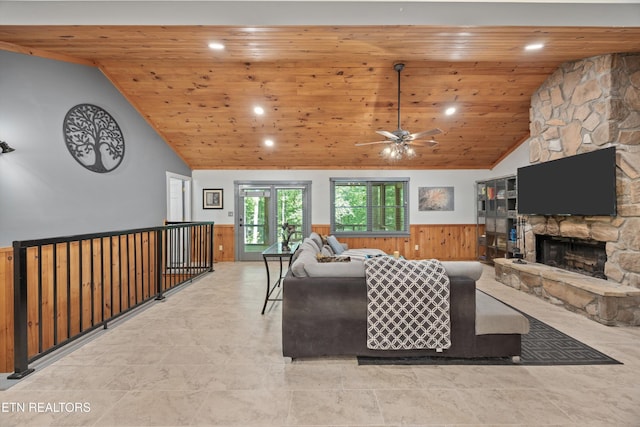 2991 Walden Flats Way, Sevierville, TN 37862 - living area featuring wooden ceiling, a wainscoted wall, a ceiling fan, a stone fireplace, and recessed lighting