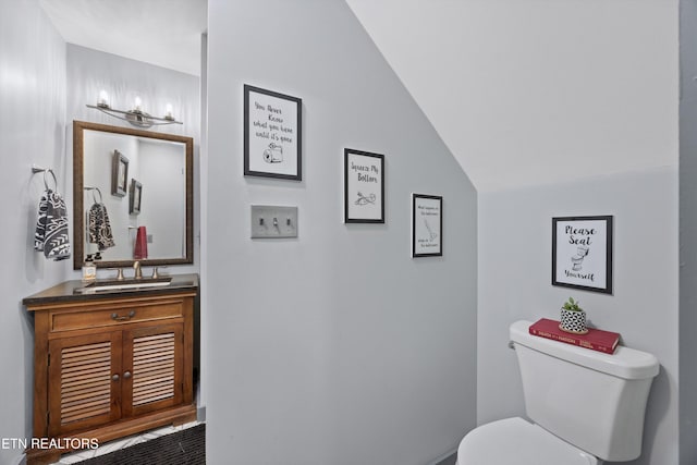 2991 Walden Flats Way, Sevierville, TN 37862 - bathroom featuring vanity and vaulted ceiling