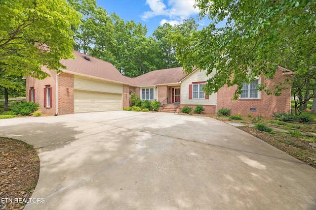 103 Wickham Ln, Fairfield Glade, TN 38558 - view of front of property with brick siding, driveway, and a garage