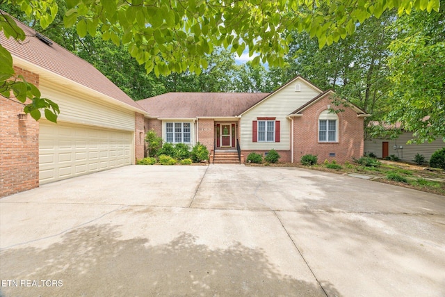 103 Wickham Ln, Fairfield Glade, TN 38558 - single story home featuring brick siding, concrete driveway, and an attached garage