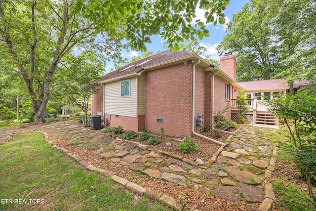 103 Wickham Ln, Fairfield Glade, TN 38558 - view of property exterior featuring a wooden deck, a chimney, brick siding, and crawl space