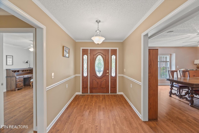 103 Wickham Ln, Fairfield Glade, TN 38558 - foyer with a textured ceiling, light wood-style flooring, a ceiling fan, and ornamental molding