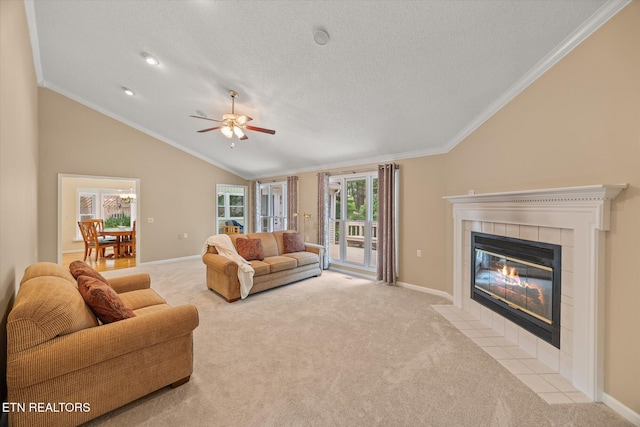 103 Wickham Ln, Fairfield Glade, TN 38558 - carpeted living area featuring a tile fireplace, lofted ceiling, crown molding, ceiling fan, and a textured ceiling
