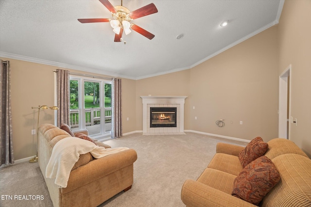 103 Wickham Ln, Fairfield Glade, TN 38558 - living area with lofted ceiling, light carpet, crown molding, a tiled fireplace, and a ceiling fan
