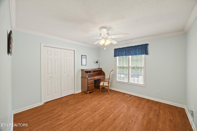 103 Wickham Ln, Fairfield Glade, TN 38558 - office with a textured ceiling, wood finished floors, ceiling fan, and ornamental molding