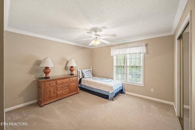 103 Wickham Ln, Fairfield Glade, TN 38558 - bedroom featuring light colored carpet, ornamental molding, a closet, a textured ceiling, and ceiling fan