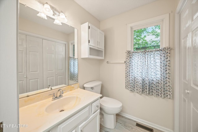 103 Wickham Ln, Fairfield Glade, TN 38558 - bathroom featuring vanity, a closet, and wood finished floors