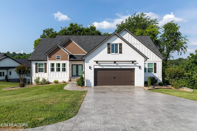 9401 Shirley Ann Rd, Kodak, TN 37764 - view of front of home featuring board and batten siding, decorative driveway, a front yard, roof with shingles, and french doors