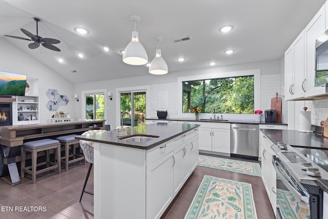 9401 Shirley Ann Rd, Kodak, TN 37764 - kitchen featuring appliances with stainless steel finishes, backsplash, recessed lighting, a ceiling fan, and hanging light fixtures