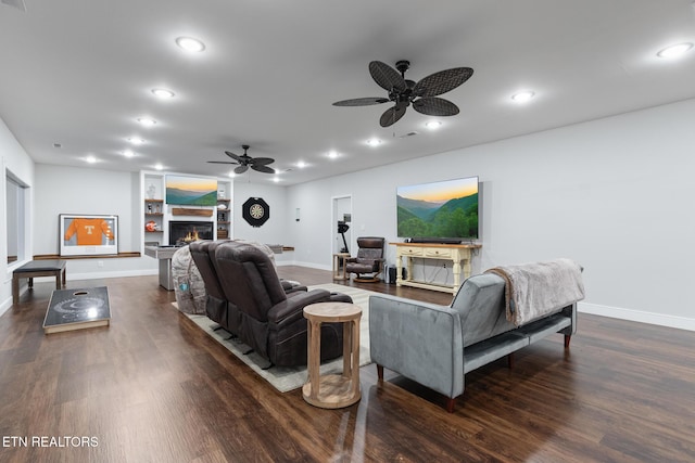 9401 Shirley Ann Rd, Kodak, TN 37764 - living area featuring a ceiling fan, dark wood finished floors, a lit fireplace, recessed lighting, and built in features