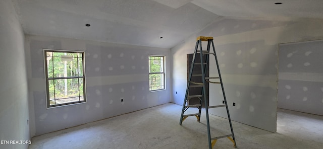 2333 Arrow Trl, Monterey, TN 38574 - unfurnished bedroom with lofted ceiling and concrete floors