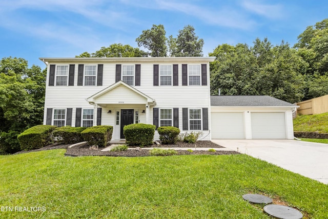8306 Foxworth Trl, Powell, TN 37849 - colonial home with concrete driveway and an attached garage