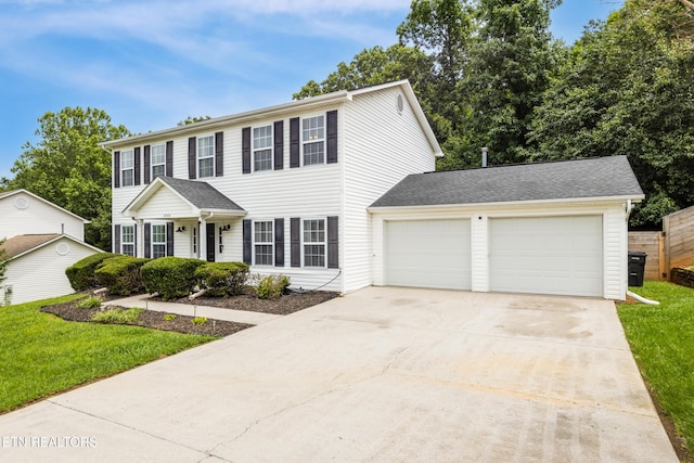 8306 Foxworth Trl, Powell, TN 37849 - colonial house featuring driveway, an attached garage, and a front lawn