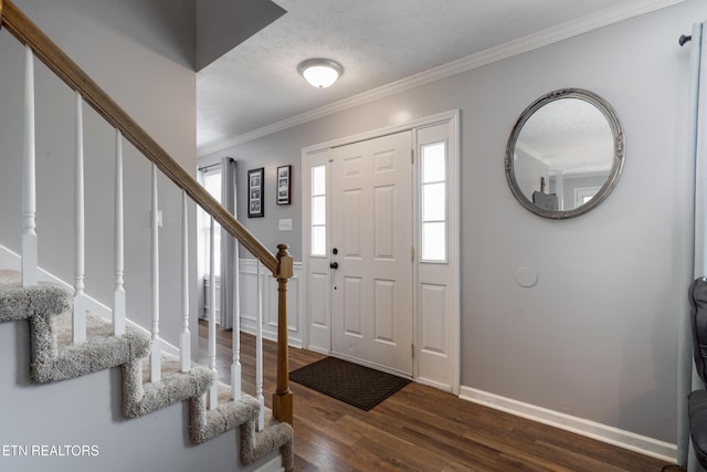 8306 Foxworth Trl, Powell, TN 37849 - entryway featuring stairway, dark wood-type flooring, crown molding, and a textured ceiling