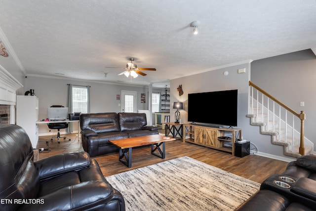 8306 Foxworth Trl, Powell, TN 37849 - living area with ceiling fan, a textured ceiling, wood finished floors, a desk, and crown molding