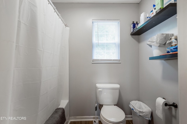8306 Foxworth Trl, Powell, TN 37849 - full bathroom featuring shower / bath combination with curtain and wood finished floors
