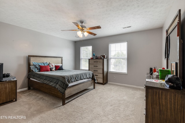 8306 Foxworth Trl, Powell, TN 37849 - bedroom with light colored carpet, a textured ceiling, and a ceiling fan