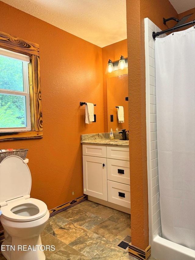 1659 Cherohala Skwy, Tellico Plains, TN 37385 - bathroom with a textured wall, vanity, stone finish floors, and a shower with shower curtain