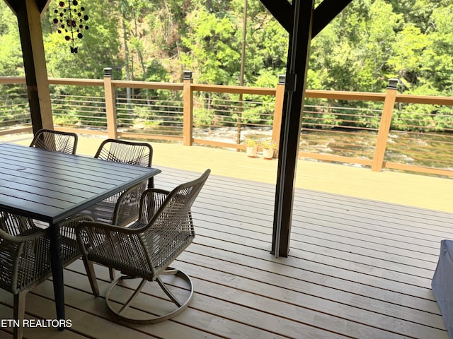 1659 Cherohala Skwy, Tellico Plains, TN 37385 - wooden deck featuring outdoor dining area and a wooded view