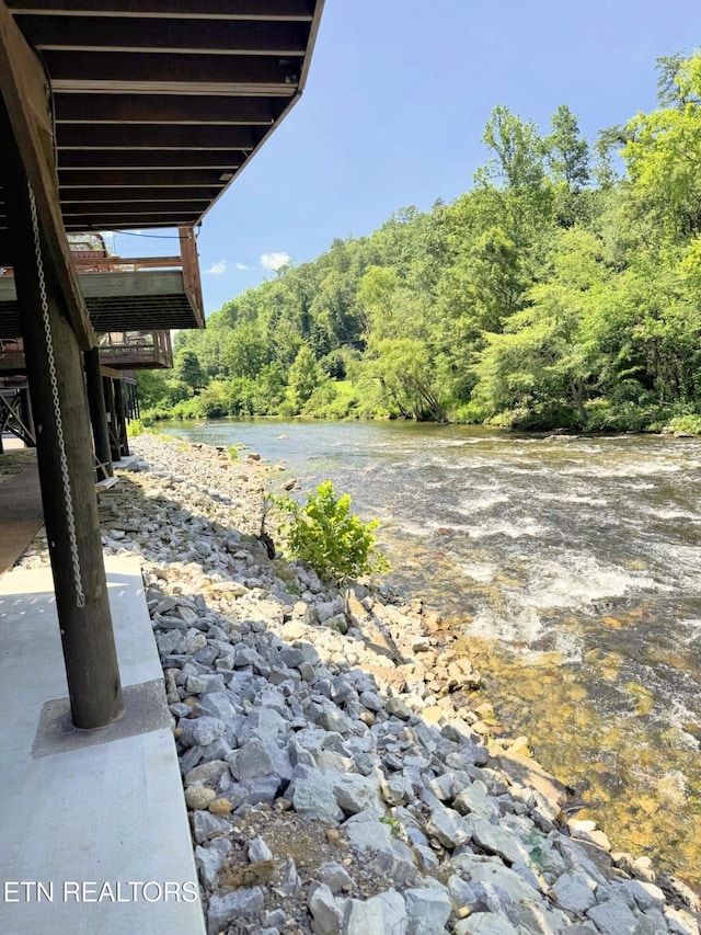 1659 Cherohala Skwy, Tellico Plains, TN 37385 - view of patio / terrace featuring a forest view and a water view