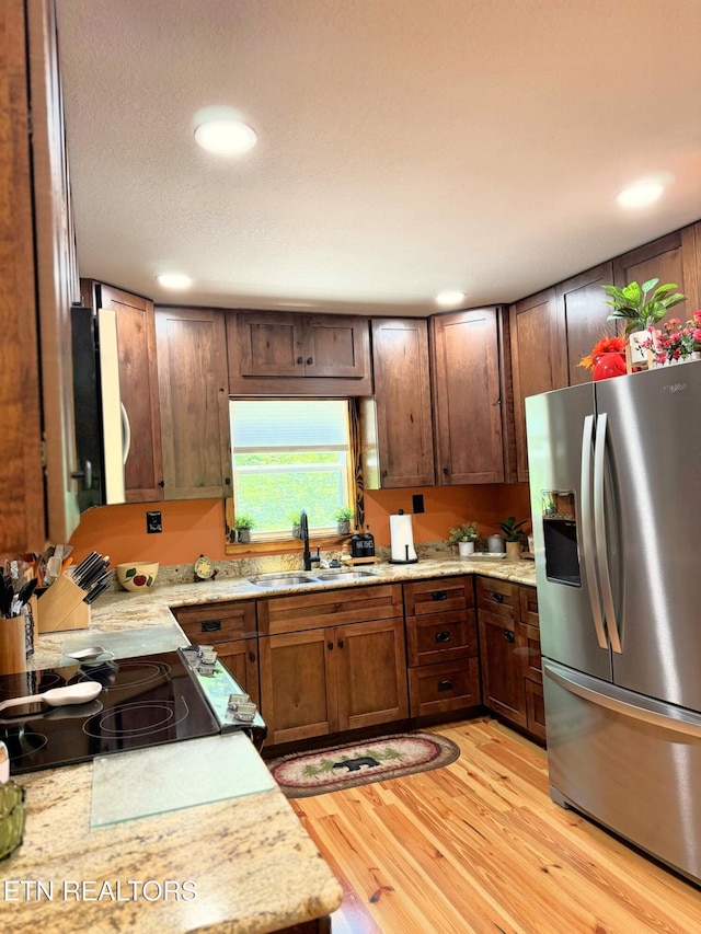 1659 Cherohala Skwy, Tellico Plains, TN 37385 - kitchen featuring stainless steel refrigerator with ice dispenser, light wood-style flooring, recessed lighting, and stovetop