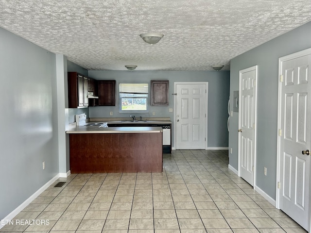 1582 Meadow Springs Dr, Jefferson City, TN 37760 - kitchen with electric range, a peninsula, ventilation hood, light tile patterned floors, and a textured ceiling