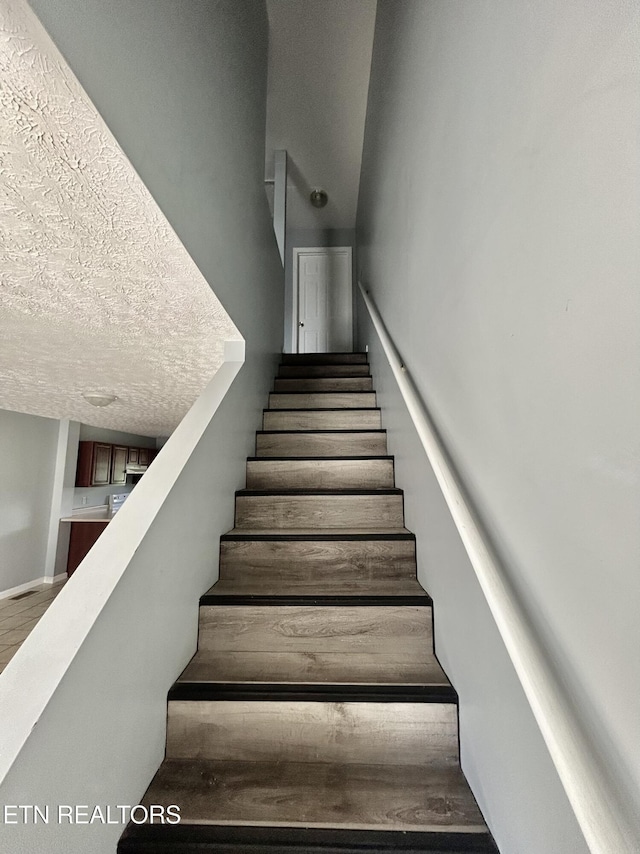 1582 Meadow Springs Dr, Jefferson City, TN 37760 - stairway featuring wood finished floors and a textured ceiling