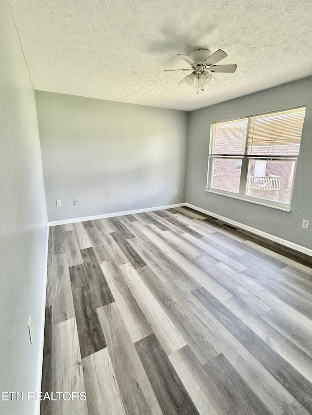 1582 Meadow Springs Dr, Jefferson City, TN 37760 - unfurnished room with a textured ceiling, ceiling fan, and wood finished floors