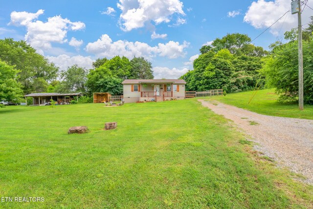 555 N Trigonia Rd, Greenback, TN 37742 - view of front of property with a front yard, driveway, and a porch