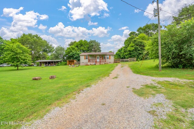 555 N Trigonia Rd, Greenback, TN 37742 - single story home with gravel driveway and a front yard