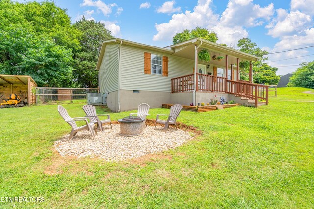 555 N Trigonia Rd, Greenback, TN 37742 - rear view of property featuring a fire pit, covered porch, and crawl space