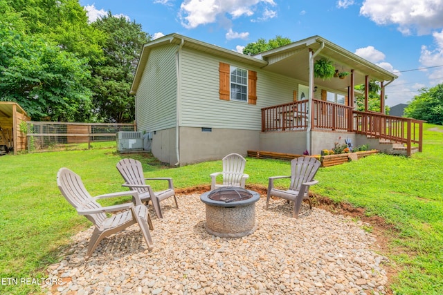 555 N Trigonia Rd, Greenback, TN 37742 - back of property with a fire pit, crawl space, and a porch