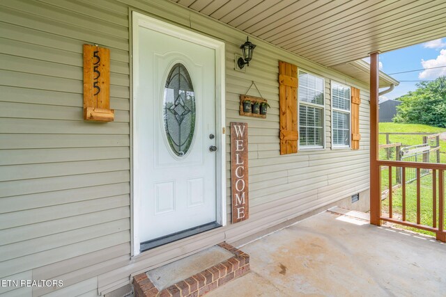 555 N Trigonia Rd, Greenback, TN 37742 - view of exterior entry with crawl space and covered porch
