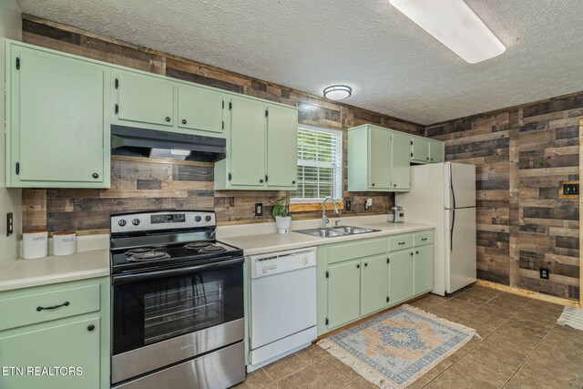 555 N Trigonia Rd, Greenback, TN 37742 - kitchen featuring white appliances, under cabinet range hood, wooden walls, a textured ceiling, and tasteful backsplash