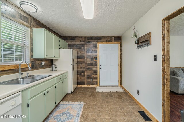 555 N Trigonia Rd, Greenback, TN 37742 - kitchen featuring white appliances, green cabinetry, wooden walls, a textured ceiling, and light countertops