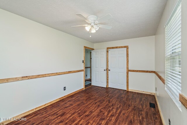 555 N Trigonia Rd, Greenback, TN 37742 - unfurnished bedroom featuring wood finished floors, a textured ceiling, multiple windows, and ceiling fan