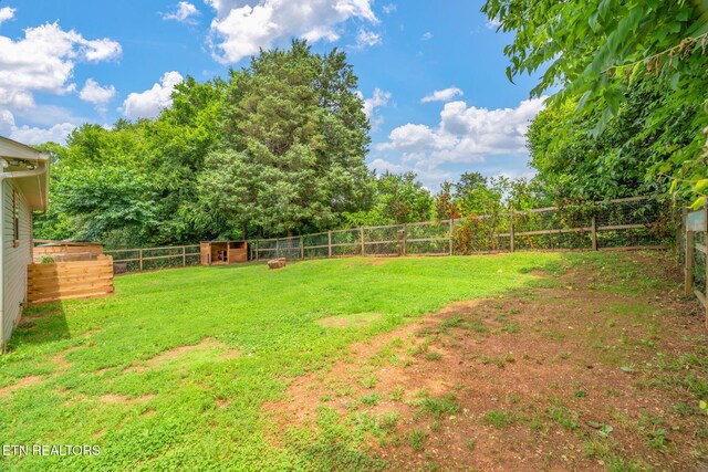 555 N Trigonia Rd, Greenback, TN 37742 - fenced backyard featuring an outdoor structure