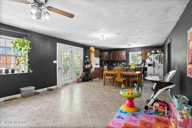 330 Dilbeck Ln, Caryville, TN 37714 - dining space with a textured ceiling, ceiling fan, and light flooring