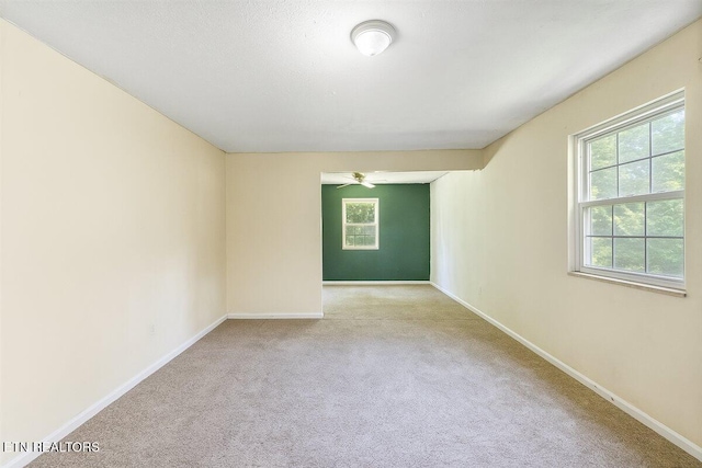 330 Dilbeck Ln, Caryville, TN 37714 - carpeted empty room with baseboards and a ceiling fan